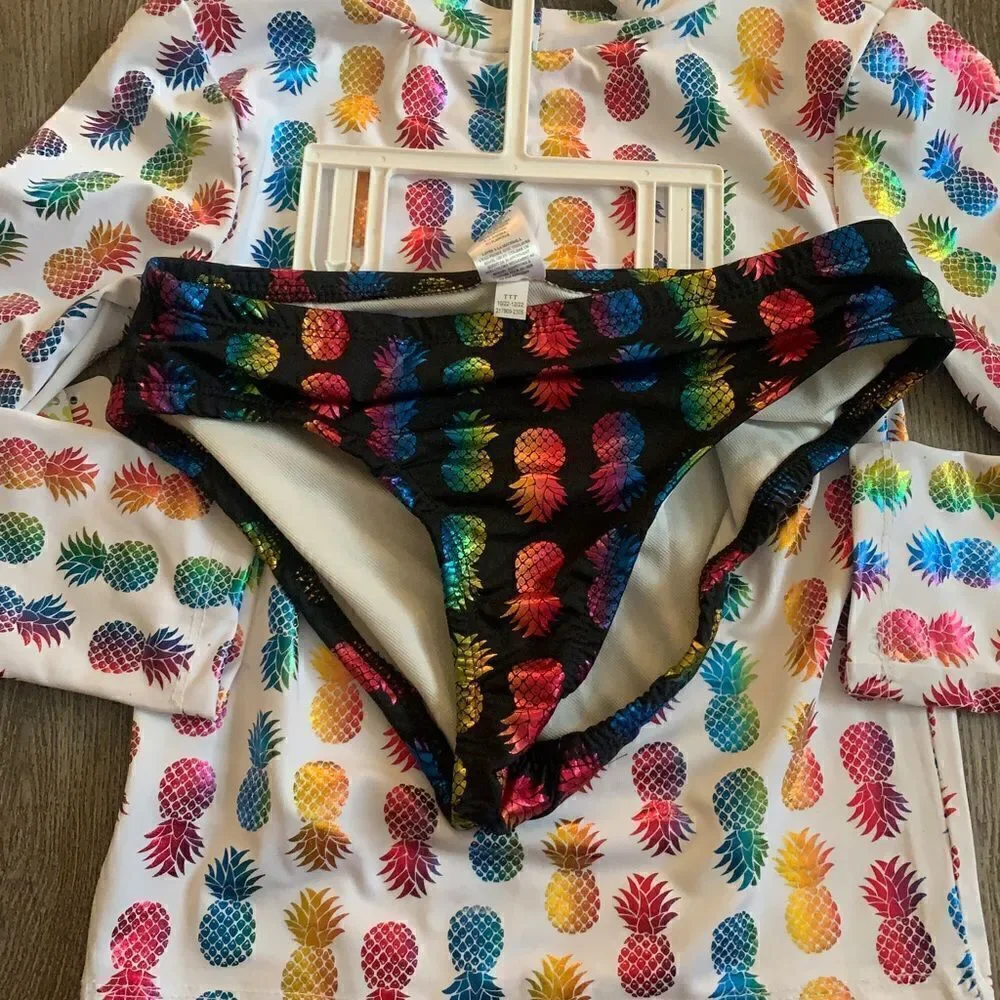 Penelope Mac girls 2 pc bathing suit with pineapple graphic design